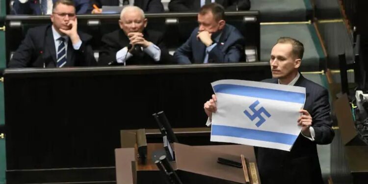 Far-Right Polish MP Draws Outrage With Swastika On Israeli Flag 1 Far-Right Polish MP Draws Outrage With Swastika On Israeli Flag