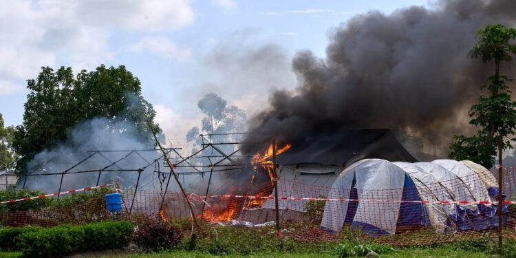 Protesters set Ebola treatment center on fire in DRC, demanding return of body
