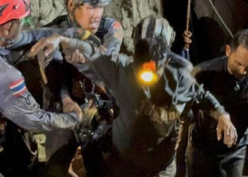 Rescuers pull first trapped person from flooded Laos cave