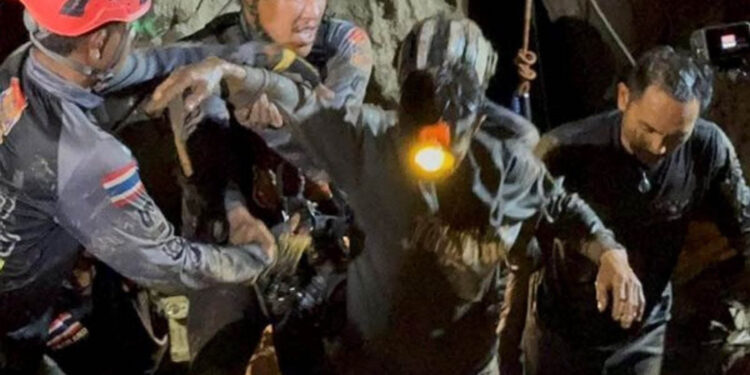Rescuers pull first trapped person from flooded Laos cave