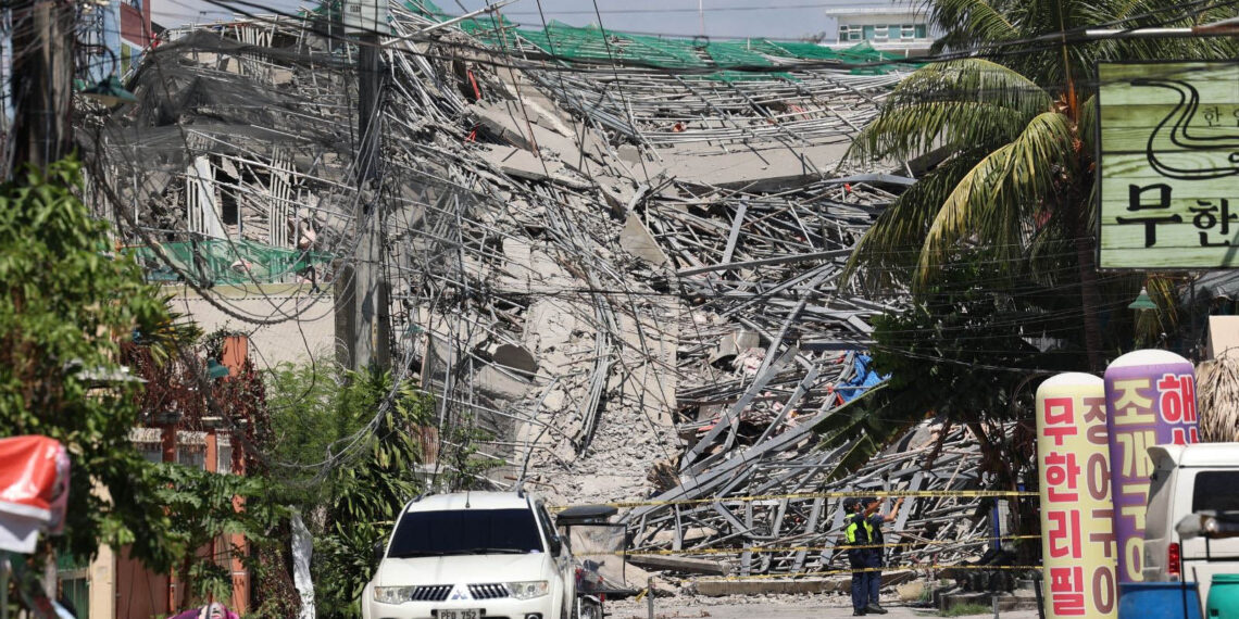 Dozens feared trapped after nine-storey building collapses in the Philippines