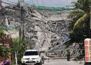 Dozens feared trapped after nine-storey building collapses in the Philippines
