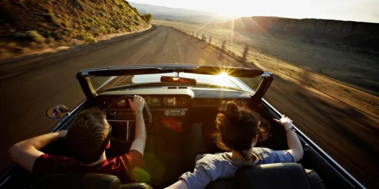 Is the convertible heading into the sunset? 1 Is the convertible heading into the sunset?