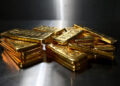 Gold climbs as weaker dollar, easing inflation lift bullion prices