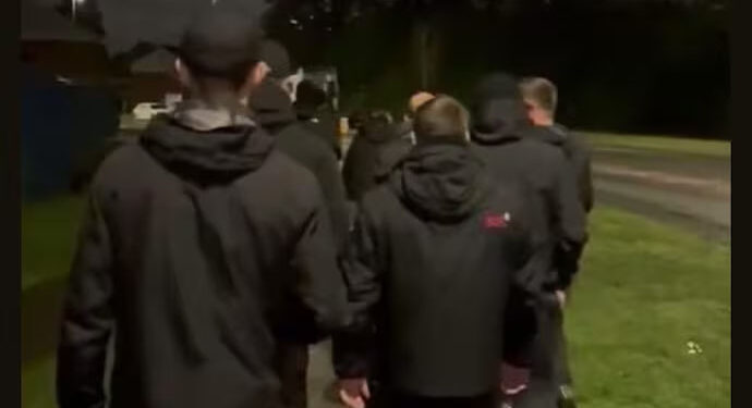 Go home: Dressed in all black, UK vigilantes bar Indian students from park